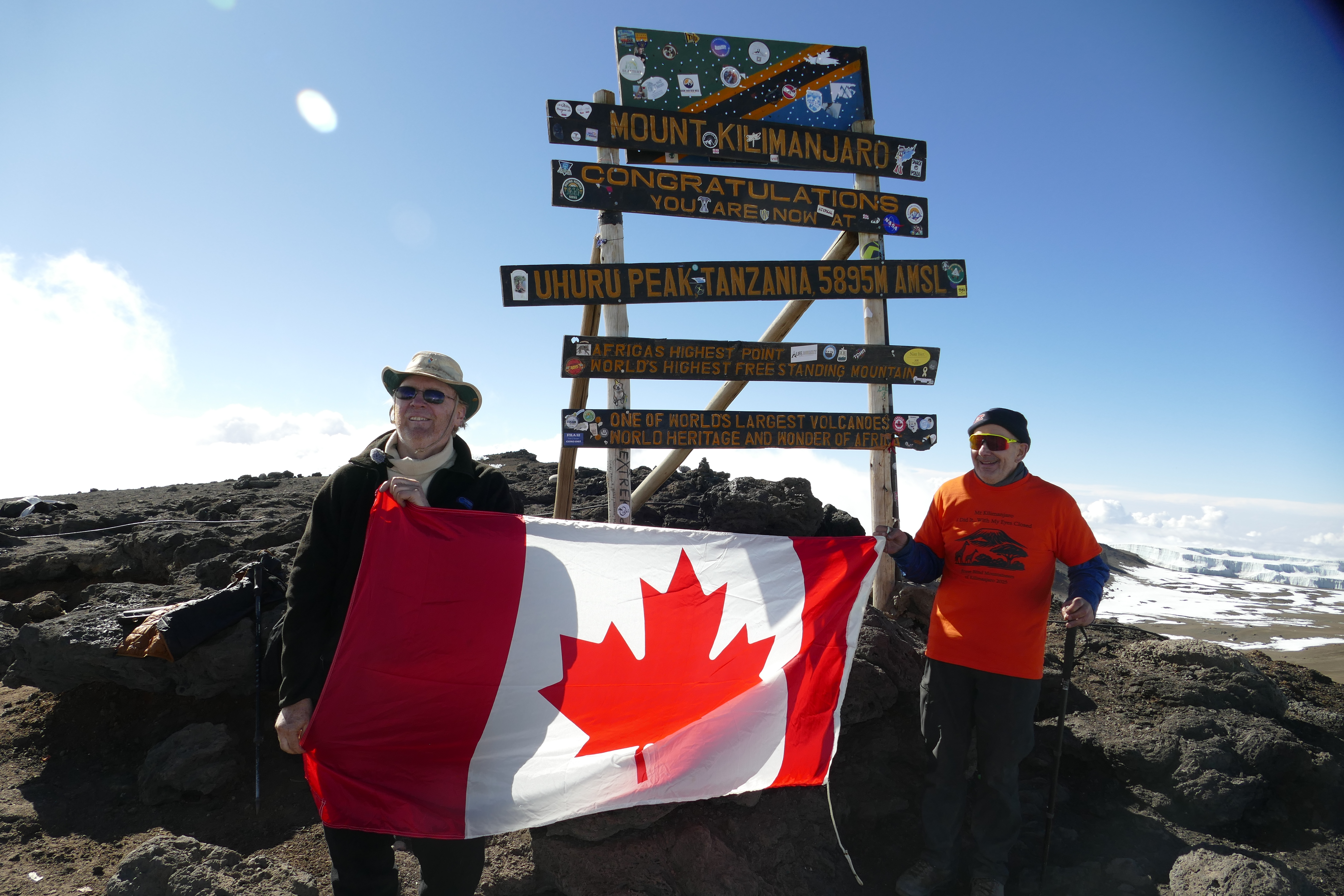 2025 October 7 Kilimanjaro summit photo with Peter and Canadian flag